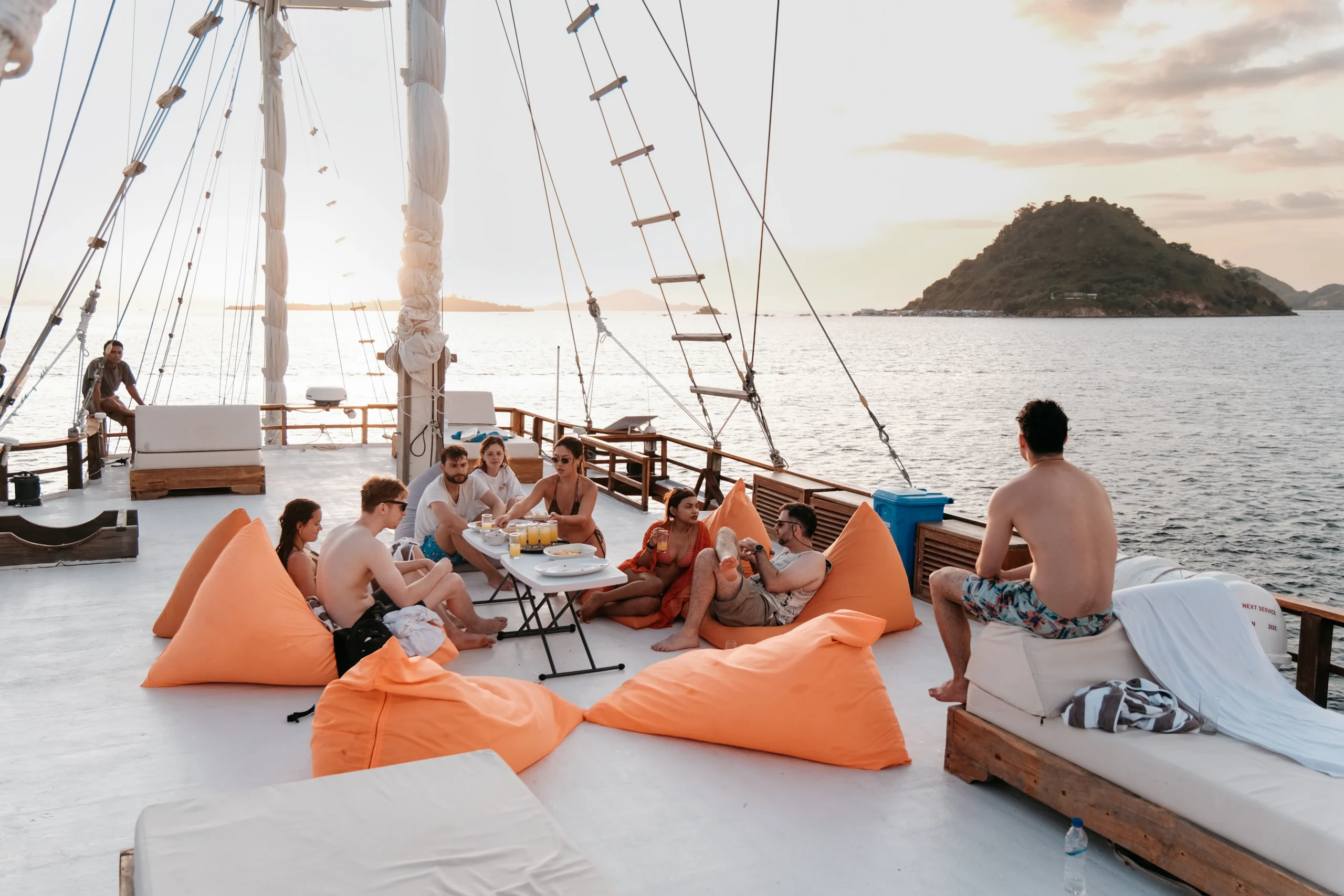 Sunset moment on Elrora deck with guests relaxing.